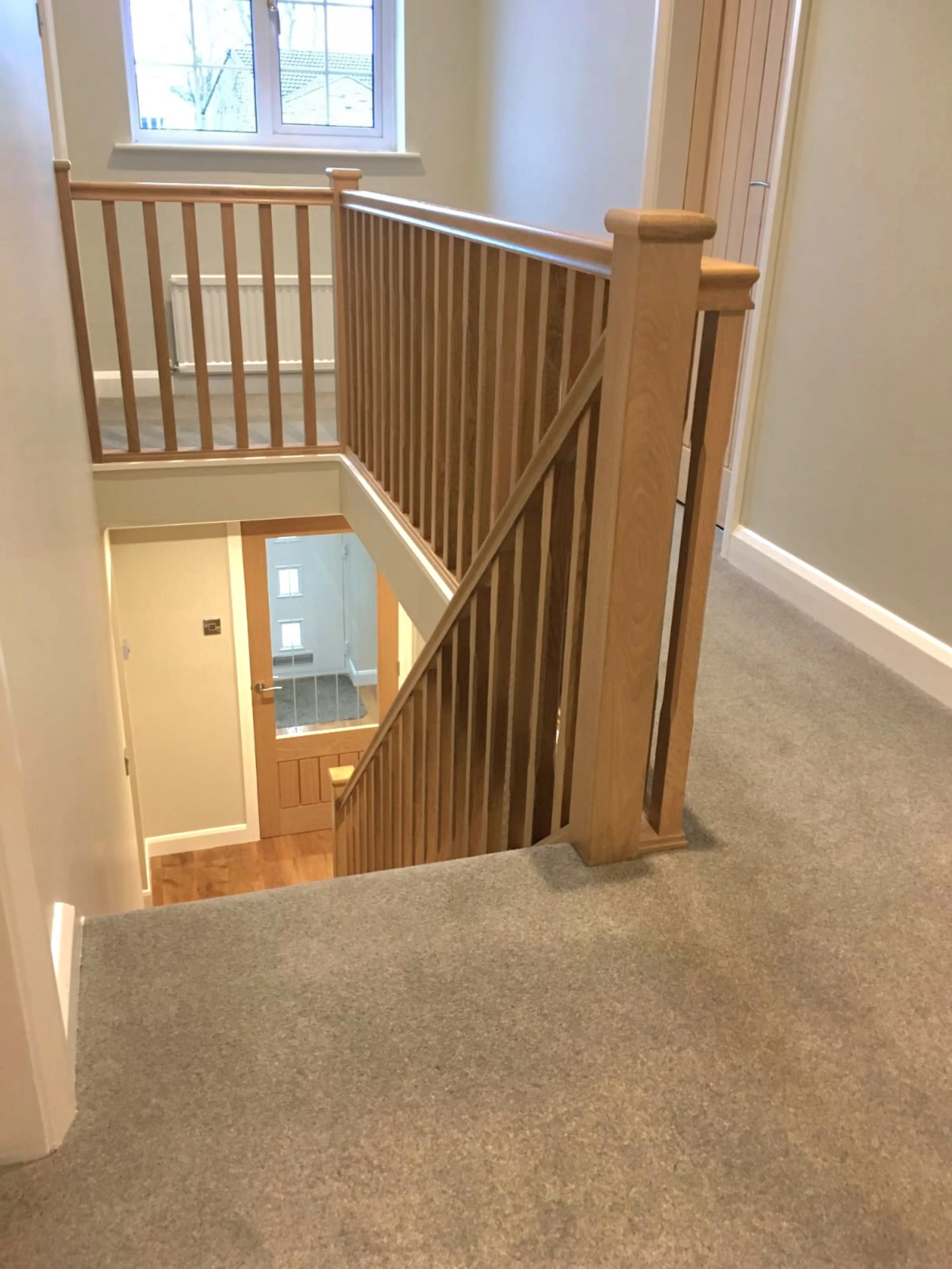 Oak staircase and balustrade joinery by RGS Joinery and Building